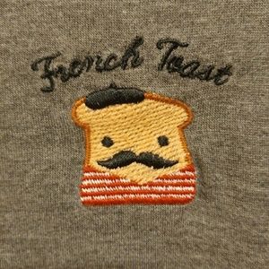An embroidered french toast shirt.